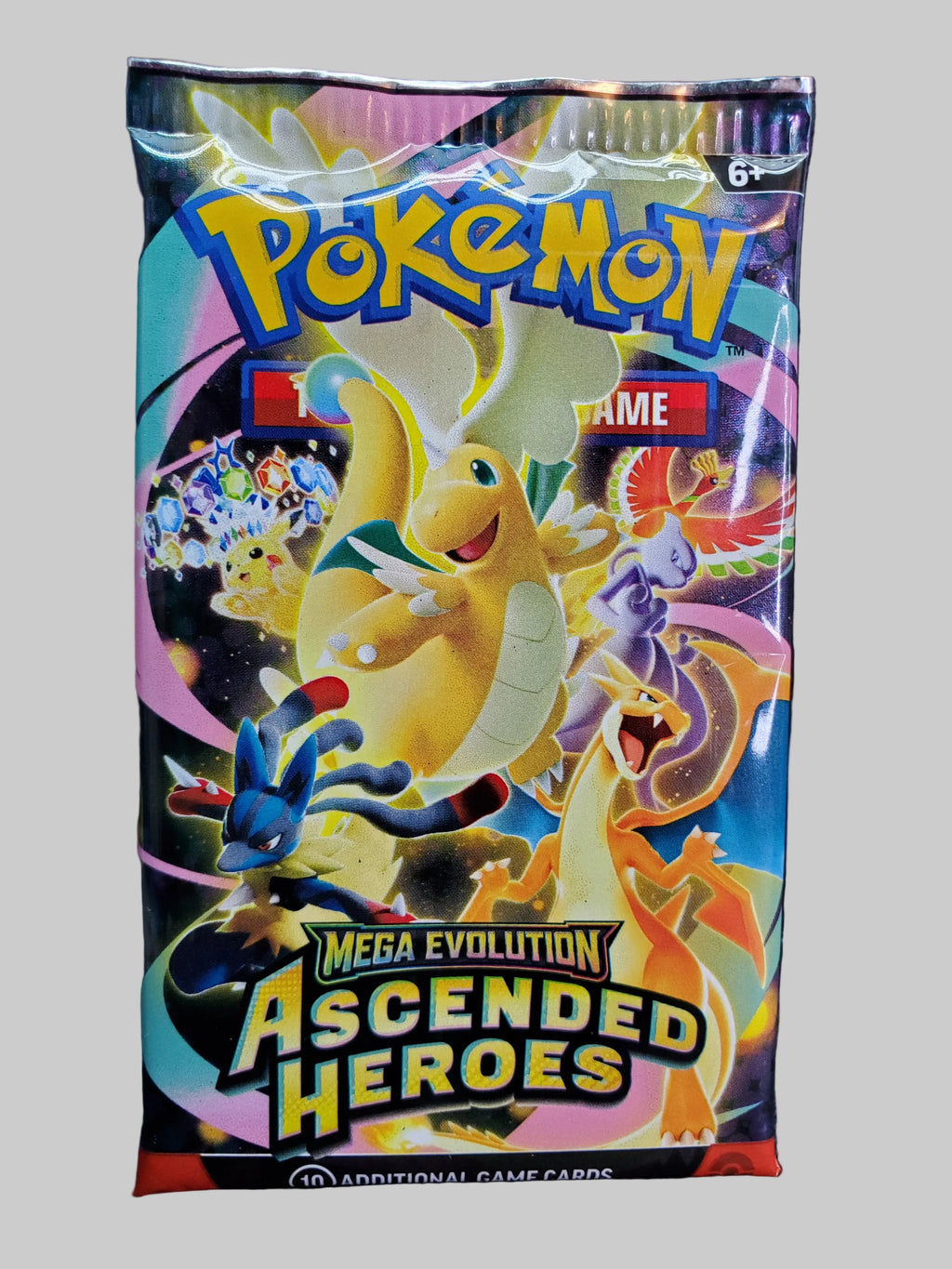 A sealed Pokémon TCG booster pack for 'Mega Evolution Ascended Heroes' featuring colorful artwork of various Pokémon characters on the front, photographed against a dark textured background.