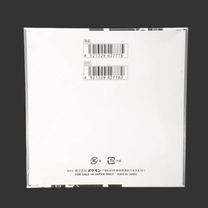White product box with barcodes on a black background – Pokémon TCG