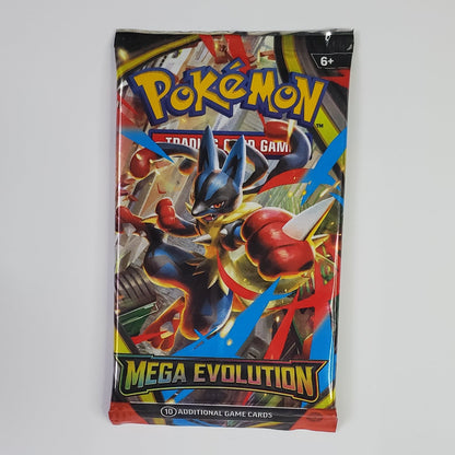 A sealed Pokémon TCG booster pack for 'Mega Evolution' stands upright against a plain white wall. The pack artwork features a dynamic illustration of a blue and red Pokémon character with the 'Pokémon' logo at the top and 'MEGA EVOLUTION' printed in large yellow text near the bottom.