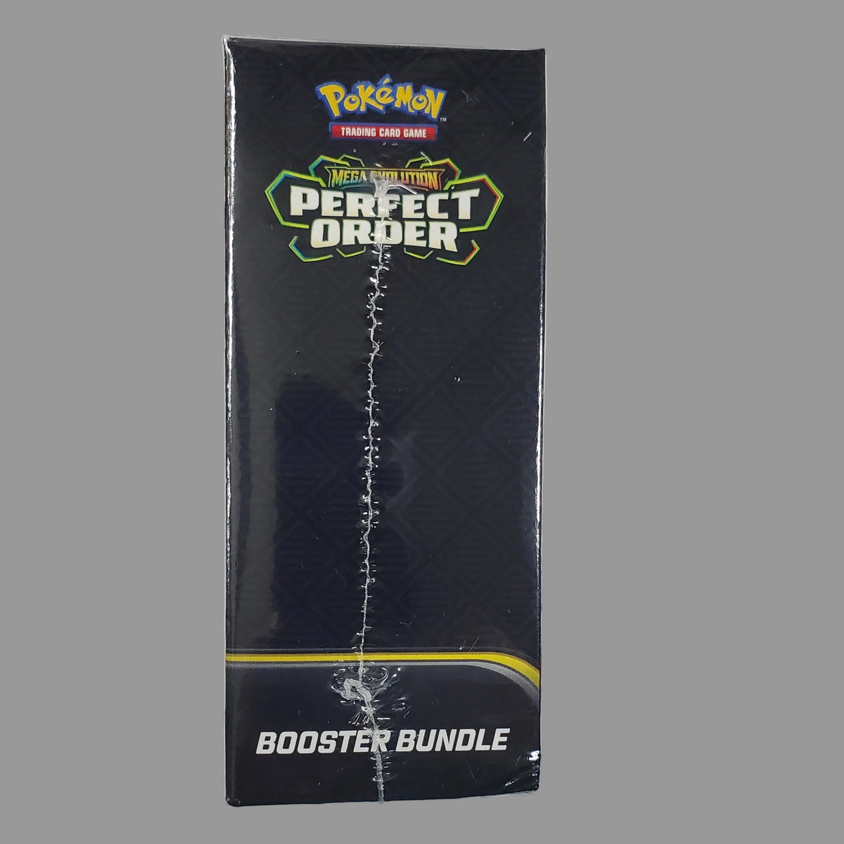 A sealed black Pokémon TCG booster bundle box labeled 'Pokémon The Perfect Deck' and 'Booster Bundle' on a white surface.