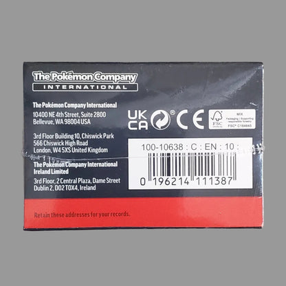 The Pokémon Company International product packaging box, showing the back side with text, barcodes, and UKCA/CE markings, placed on a light gray surface.