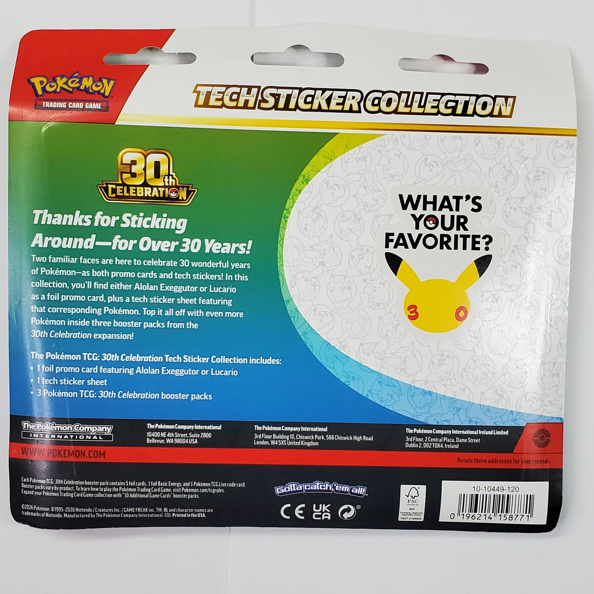 A packaged Pokémon TCG card, specifically 'What's Favorite?' from the 2024 Mastered Collection, shown on a white desk next to a keyboard and an art card.