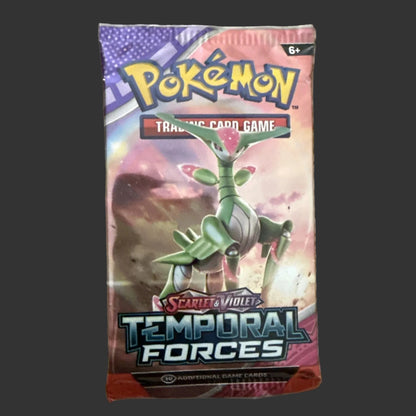 Sealed Pokémon boster pack says Scarlet & violet Temporal Forces on the front. Pack is on a dark background