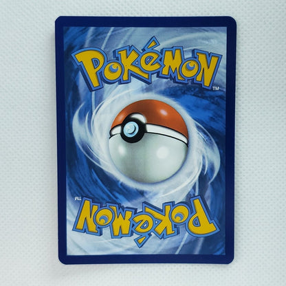 A Pokémon card sleeve featuring the classic blue and white swirl background with a red and white Pokémon ball in the center and yellow 'Pokémon' lettering, shown on a light textured surface.