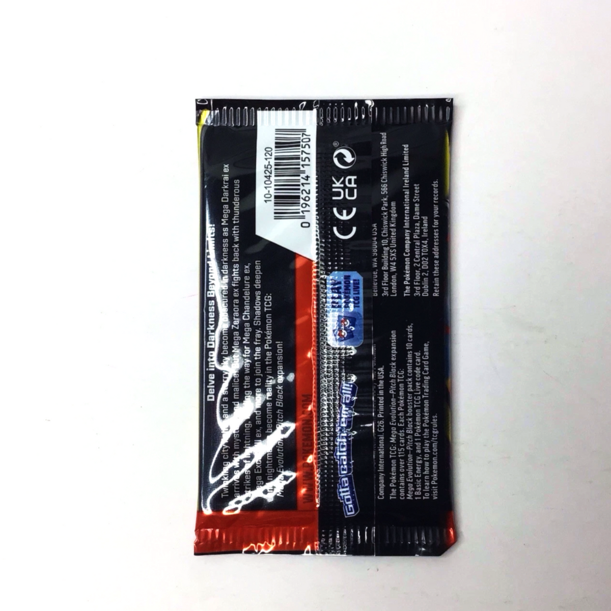 The back of a small rectangular product packaging sleeve, showing a barcode, regulatory text, and a red and black design, photographed on a plain white surface.
