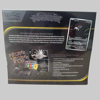The back of a Pokémon TCG Mega Evolution Pitch Black Elite Trainer Box package, photographed on a wooden tabletop. The box shows product contents, rules text, a card example, and branding for Pokémon, Mega Evolution, and Pitch Black.