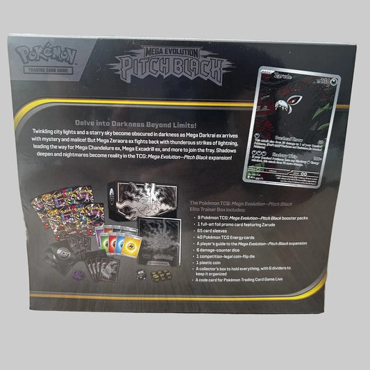 The back of a Pokémon TCG Mega Evolution Pitch Black Elite Trainer Box package, photographed on a wooden tabletop. The box shows product contents, rules text, a card example, and branding for Pokémon, Mega Evolution, and Pitch Black.