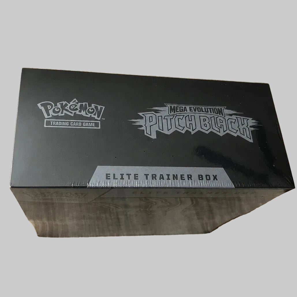 Pokémon Trading Card Game Mega Evolution Pitch Black Elite Trainer Box in its shrink-wrapped black packaging, displayed on a light wood grain surface.