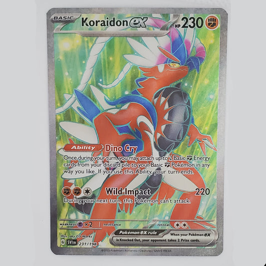 A single Pokémon TCG trading card for Koraidon GX, featuring artwork of the character Koraidon in red, blue, and white against a green background, photographed on a light neutral surface.