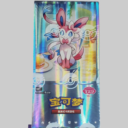 A Pokémon TCG booster box featuring Mew on the front, photographed against a plain off-white background. The box has holographic silver-blue foil on the top half and a dark purple bottom section with text and a card preview.