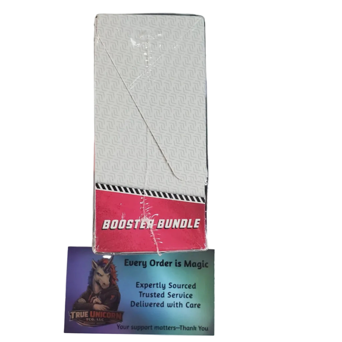 A sealed retail box for a 'Thick Thicker' booster bundle, showing a red band labeled 'BOOSTER BUNDLE' and a small promotional card below it on a plain light background.