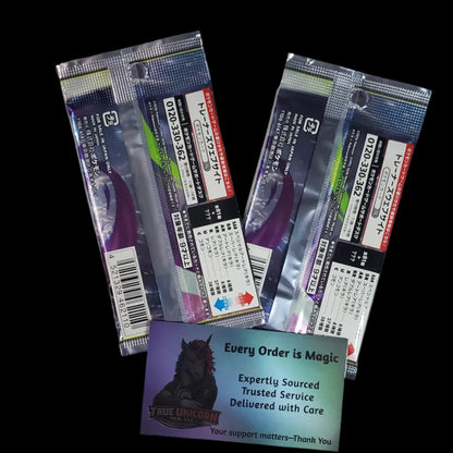 Two silver foil packets of Japanese Pokémon booster packs on a dark backdrop