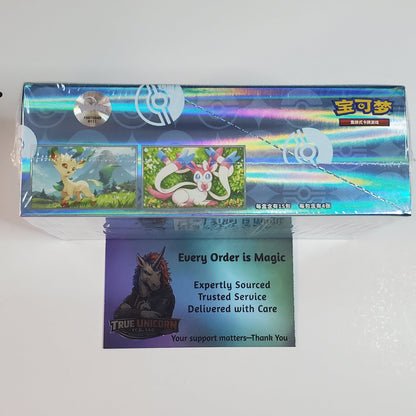 A sealed holographic box of The Powerpuff Girls trading cards, featuring the blue and pink character artwork, with a support card placed in front on a plain white surface.