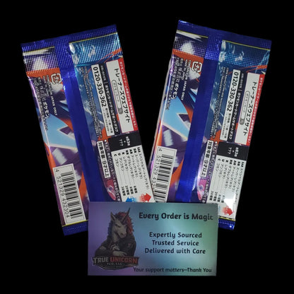 The back of two sealed Pokémon TCG: M4 Ninja Spinner booster packs with a True Unicorn TCG thank you card saying Every Order is Magic on a transparent background. 